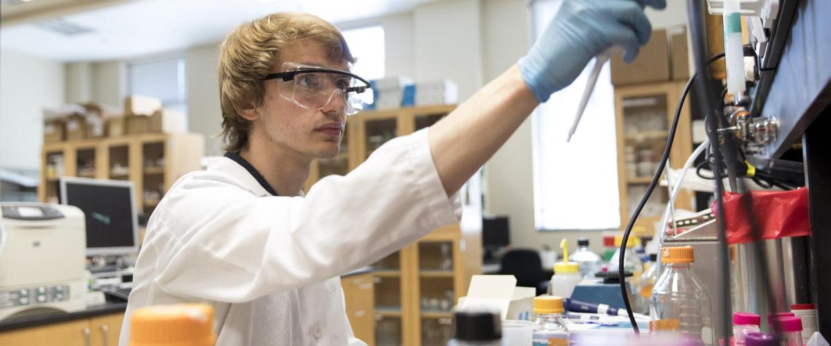 Student in biology laboratory