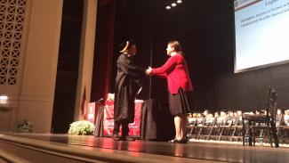 Graduate shaking hands with Director